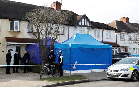 Police stand on duty outside the home of Nikolai Glushkov in New Malden, on the outskirts of London Britain, March 14, 2018. REUTERS/Peter Nicholls