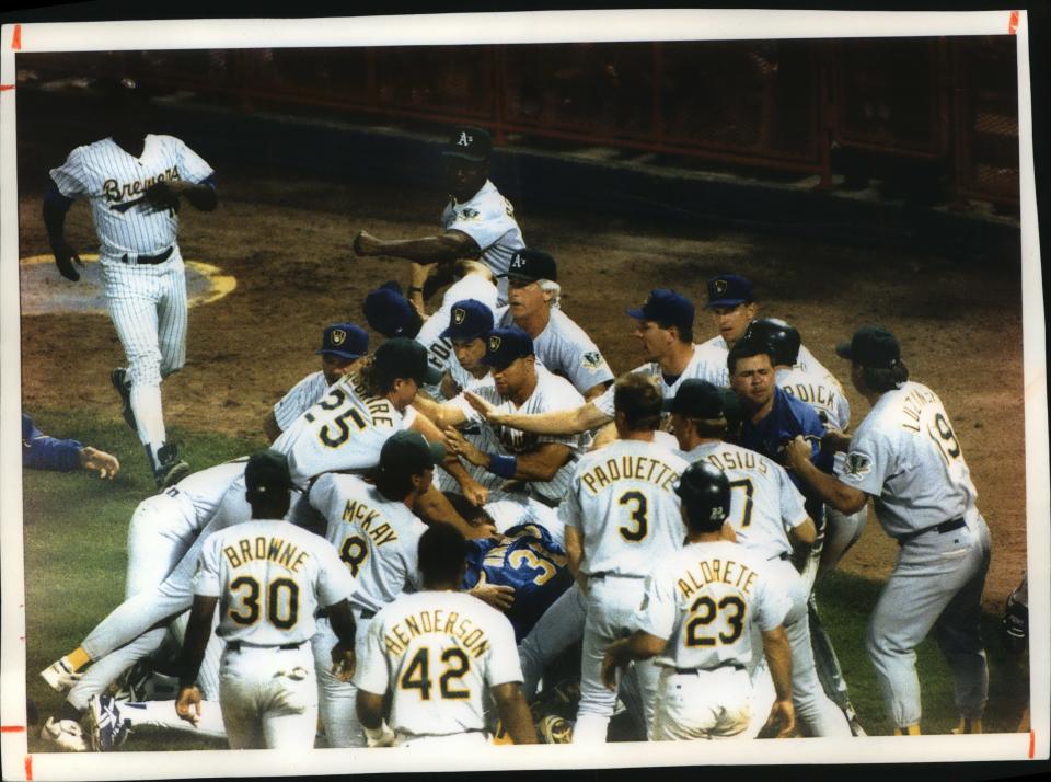 The Milwaukee Brewers and the Oakland Athletics mix it up during the second game of a doubleheader early in the morning of Aug. 25, 1993.