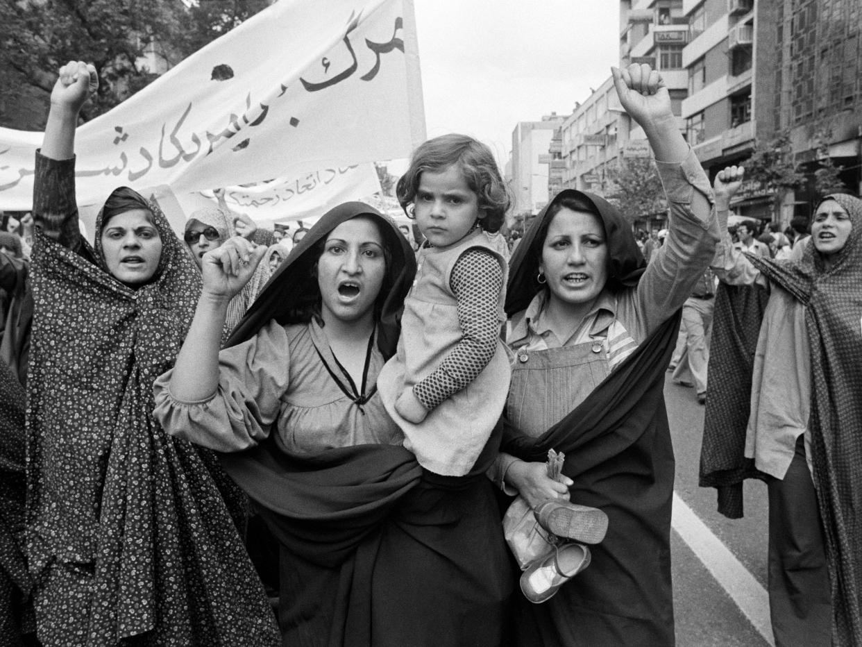 Women and a young girl at a demonstration during the Iranian Revolution.