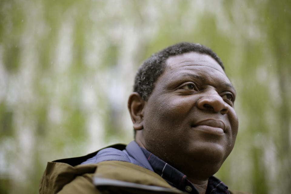 In this Monday, April 22, 2019 photo Goldman Environmental Prize winner Alfred Brownell, a Liberian environmental lawyer and human rights activist, stands for a photograph, in Boston. Brownell, a distinguished scholar at Northeastern University School of Law in Boston, says he was forced to flee his country over his fight to hold a Southeast Asian palm oil company accountable for its alleged destruction of Liberian forest and abuse of indigenous communities living around palm oil plantations. (AP Photo/Steven Senne)