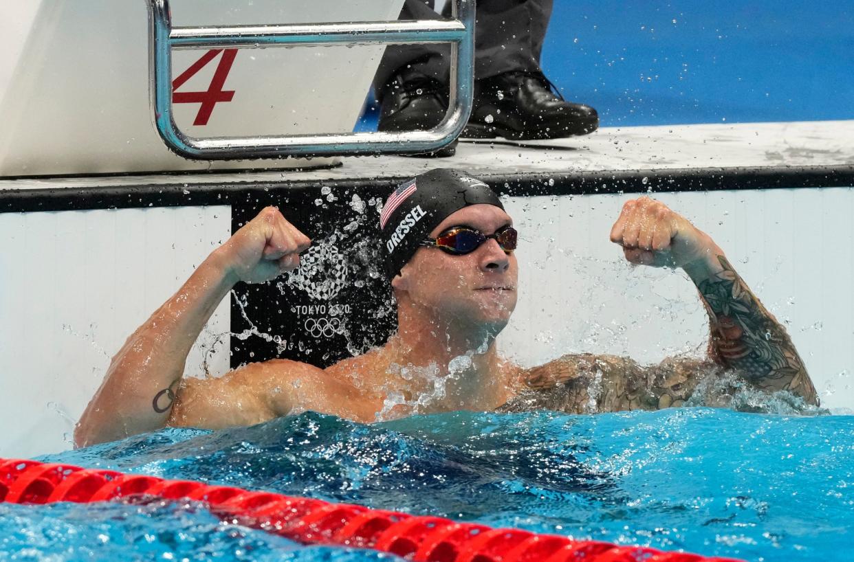 Caeleb Dressel celebrates after winning the men's 50-meter freestyle.