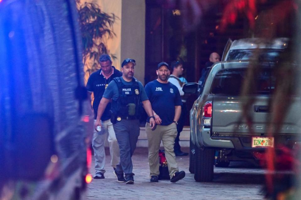 Homeland Security agents at the entrance of Diddy’s home at Star Island in Miami Monday. AFP via Getty Images