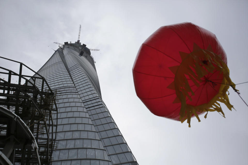 The Shanghai Tower is seen prior to the topping off ceremony in Shanghai, China, Saturday, Aug. 3, 2013. The Shanghai Tower is set to become the tallest building in China which is planned to be complete in 2014. (AP Photo/Eugene Hoshiko)