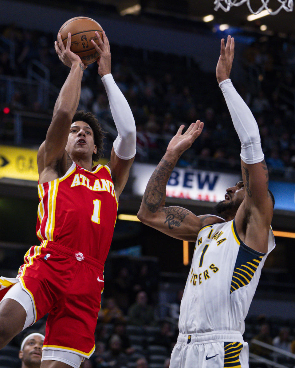 Atlanta Hawks forward Jalen Johnson (1) shoots over Indiana Pacers forward Obi Toppin (1) during the first half of an NBA preseason basketball game in Indianapolis, Monday, Oct. 16, 2023. (AP Photo/Michael Conroy)