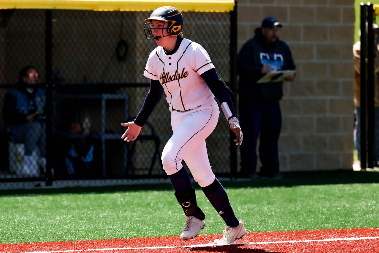 Falcon standout Belle Dalton is all smiles as she closes in on home plate after her sixth inning solo shot.