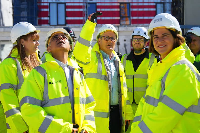 Labour Party leader Keir Starmer (C) visits Brent Cross town visitor pavilion for a housing launch with Angela Rayner, Deputy Leader of the Labour Party, (L) Rachel Reeves, Shadow Chancellor of the Exchequer (R) and Mayor of London Sadiq Khan (2nd L)