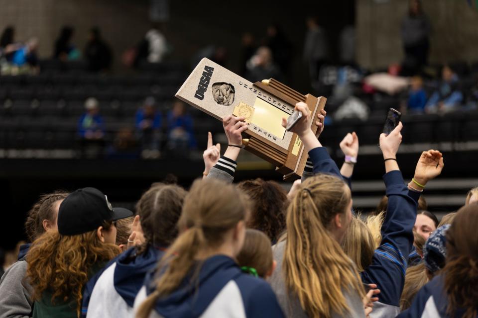 Copper Hills High School celebrates a win during the 6A Girls Wrestling State Championships at the UCCU Center in Orem on Thursday, Feb. 15, 2024. | Marielle Scott, Deseret News
