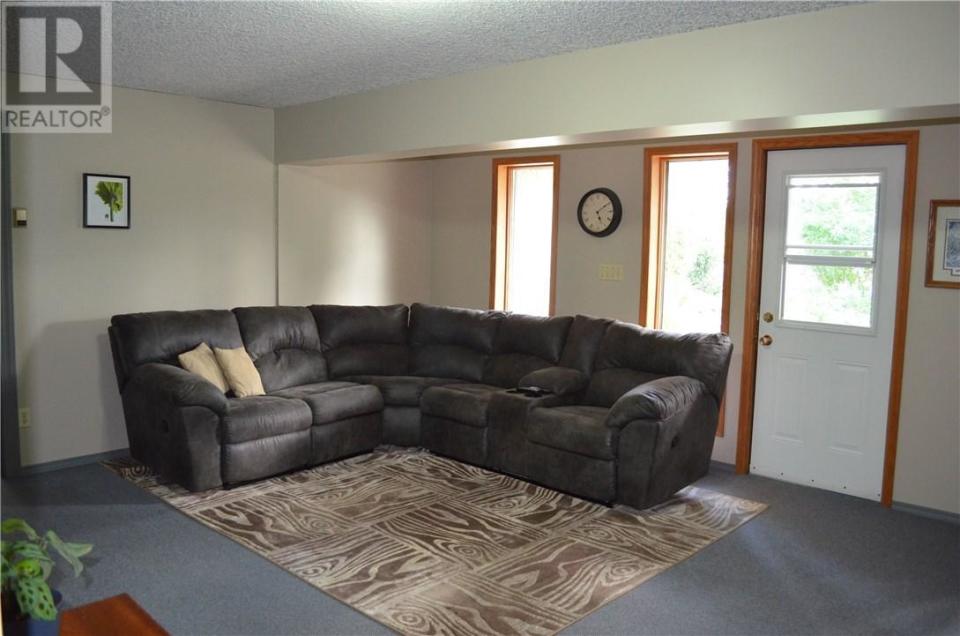 <p><span>5 Saskatoon Highway 5 East Acreage, Saskatoon, Sask.</span><br> Downstairs, there is a walkout to the spacious backyard. The property also has a heated workshop that includes its own bathroom, plus several other storage buildings.<br> (Photo: Zoocasa) </p>