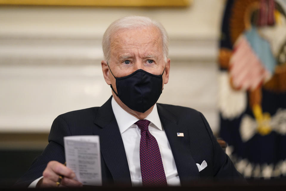 President Joe Biden participates in a roundtable discussion on a coronavirus relief package in the State Dining Room of the White House in Washington, Friday, March 5, 2021. (AP Photo/Patrick Semansky)