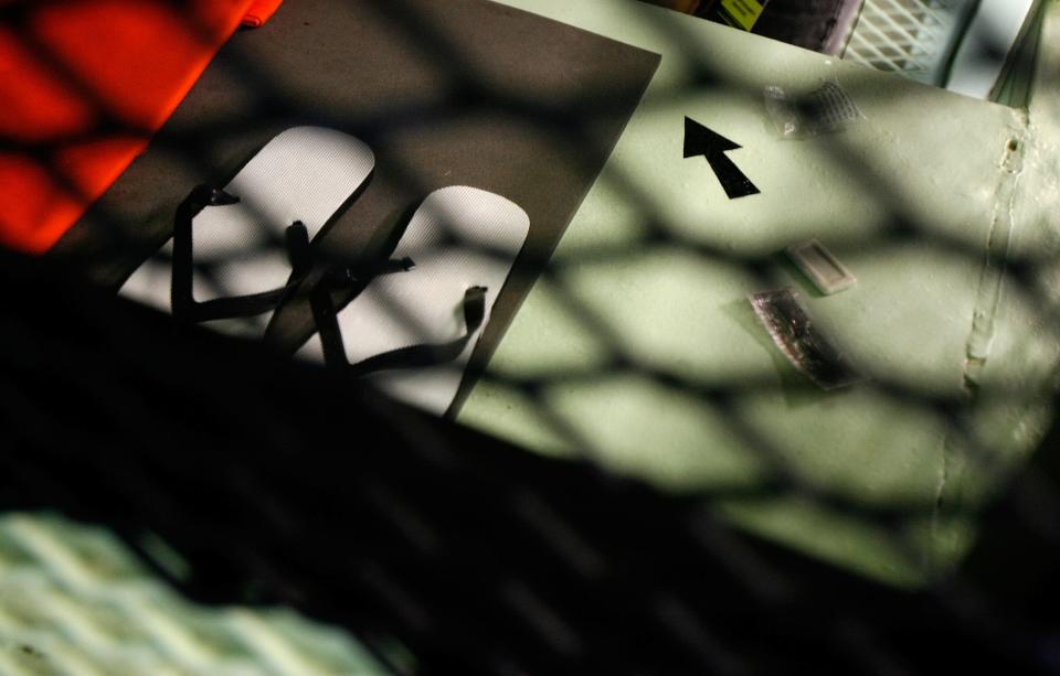 GUANTANAMO BAY, CUBA - OCTOBER 2:  (IMAGE REVIEWED BY U.S. MILITARY PRIOR TO TRANSMISSION) A small black arrow indicating the direction of Mecca is painted on a metal shelf inside a cell at Camp 1 in the detention facility at the U.S. Naval Station October 2, 2007 in Guantanamo Bay, Cuba. About 340 "unlawful enemy combatants" captured since the September 11, 2001 attacks on the United States continue to be held at the facility.  (Photo by Chip Somodevilla/Getty Images)