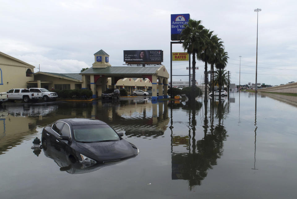 Several cars were flooded along Interstate 10 in Southeast Texas, Thursday, Sept. 19, 2019, due to Tropical Storm Imelda. The National Weather Service says Imelda is the seventh-wettest tropical cyclone to strike the 48 contiguous United States on record. (Guiseppe Barranco/The Beaumont Enterprise via AP)