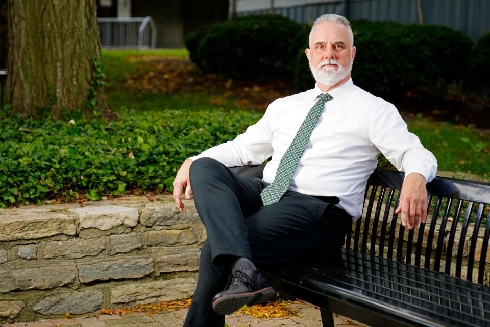 Eric Palmer poses near his office on campus at the University of Cincinnati on Thursday, Sept. 1, 2022. Palmer, a survivor of abuse during his time as a Boy Scout, is awaiting legislation that would allow survivors to recoup the full amount owed to them in the national bankruptcy settlement, instead of just a percentage currently allowed under state law. 