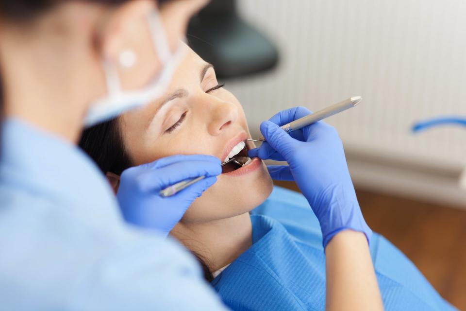 How would you feel if a robot were cleaning your teeth? <a href="https://www.shutterstock.com/image-photo/closeup-female-dentist-examining-mid-adult-144113650" rel="nofollow noopener" target="_blank" data-ylk="slk:stockfour/Shutterstock.com;elm:context_link;itc:0;sec:content-canvas" class="link ">stockfour/Shutterstock.com</a>