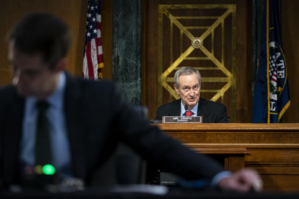 Chairman Mike Crapo, R-Idaho, speaks as Federal Reserve Chair Jerome Powell and Treasury Secretary Steven Mnuchin, not pictured, testify during a Senate Banking Committee hearing on Capitol Hill, on Tuesday, Dec. 1, 2020, in Washington. (Al Drago/The New York Times via AP, Pool)