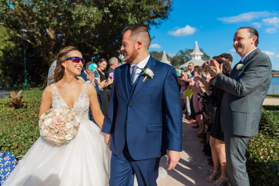 Bride Kristin Robinson, who is colorblind, sees the world in color for the first time as she celebrates her dream wedding alongside her groom and family at Disney’s Wedding Pavilion on January 25, 2023 at Walt Disney World Resort in Lake Buena Vista, Fla. (Abigail Nilsson, photographer)
