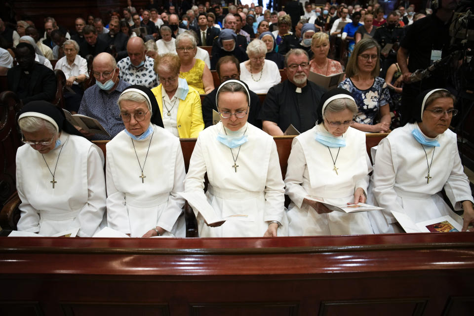 Nuns pray as Pope Francis presides over a Vespers service at the Cathedral-Basilica of Notre Dame de Quebec, Thursday, July 28, 2022, in Quebec City, Quebec. Pope Francis crisscrossed Canada this week delivering long overdue apologies to the country's Indigenous groups for the decades of abuses and cultural destruction they suffered at Catholic Church-run residential schools. (AP Photo/John Locher)