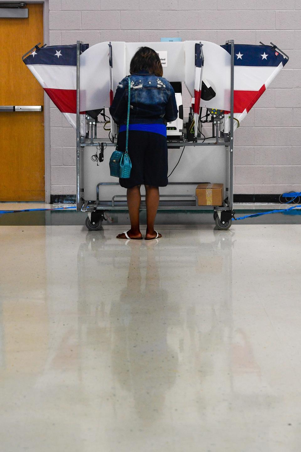A woman votes in the primary election at Thomas A. Edison Elementary in Nashville on Aug. 4.
