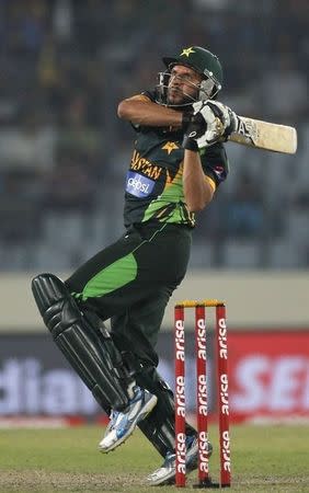 Pakistan's Shahid Afridi plays a ball against Bangladesh during their one-day international (ODI) cricket match in Asia Cup 2014 in Dhaka March 4, 2014. REUTERS/Andrew Biraj