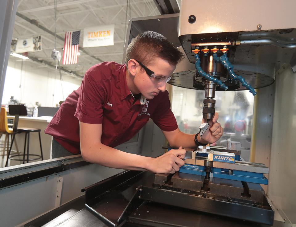 Nick El Faye, of Malvern High School, sets an indicator on a CNC machine used for milling work in the R.G. Drage engineering class.