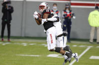 North Carolina State wide receiver C.J. Riley (19) pulls in a reception while defended by Georgia Tech defensive back Kenan Johnson (24) during the first half of an NCAA college football game in Raleigh, N.C., Saturday, Dec. 5, 2020. (Ethan Hyman/The News & Observer via AP, Pool)