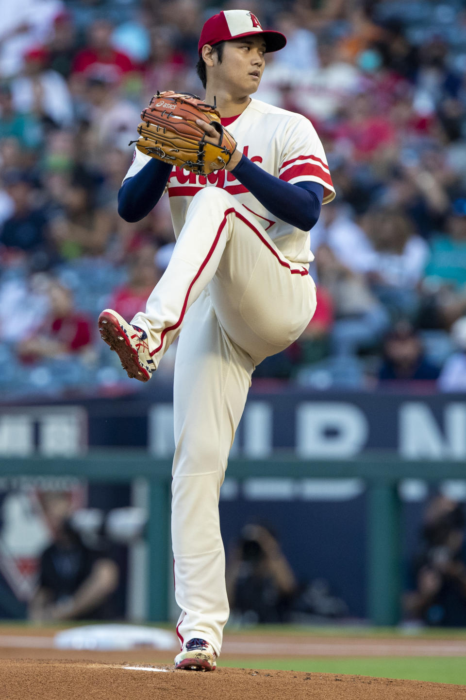 Los Angeles Angels starting pitcher Shohei Ohtani winds up to throw to a Seattle Mariners batter during the first inning of a baseball game in Anaheim, Calif., Saturday, Sept. 17, 2022. (AP Photo/Alex Gallardo)