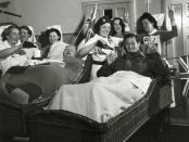 <p>Patients at Horley Military Hospital, all severely wounded in France and Italy, celebrate V-E Day with nursing staff.</p>