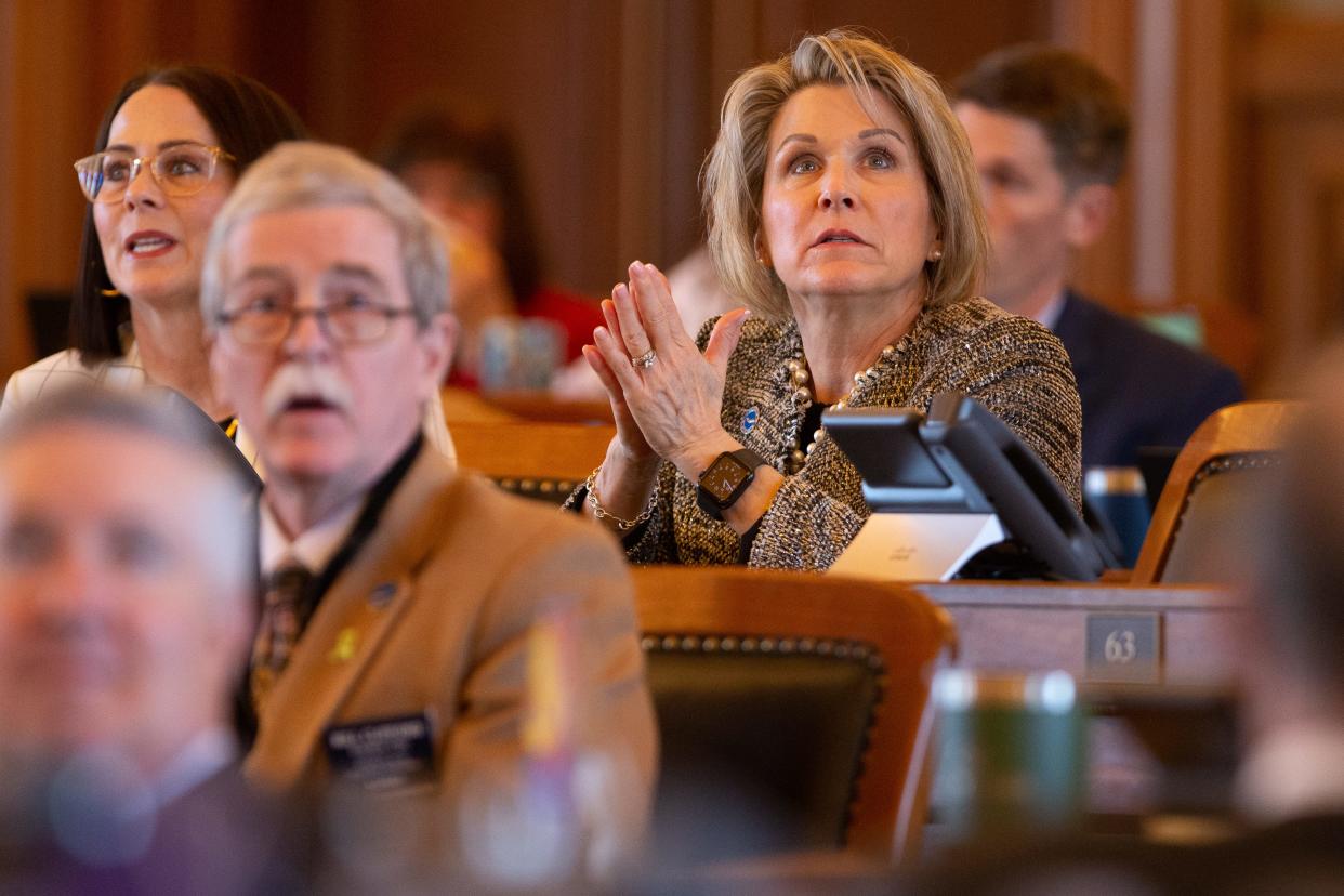 Rep. Barb Wasinger, R-Hays, watches the boards as votes come in on Wednesday's bill that would ban transathletes in Kansas.