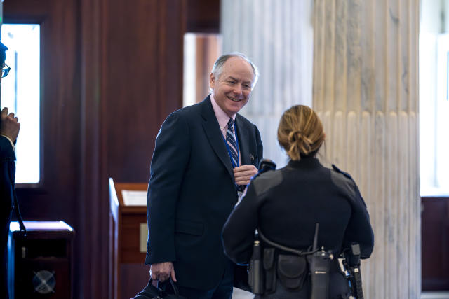 Steve Ricchetti, one of the top negotiators for President Joe Biden on the debt limit crisis, is greeted by a Capitol Police office after he passed through security to return to closed-door mediation, at the Capitol in Washington, Tuesday, May 23, 2023. (AP Photo/J. Scott Applewhite)