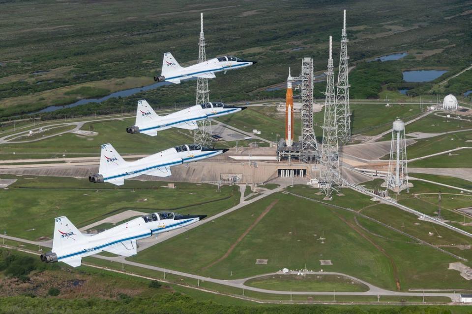 NASA T-38s fly in formation above the Space Launch System rocket on Launch Pad 39B on Aug. 23.