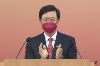 In this image made from video provided by Radio Television Hong Kong, Hong Kong Chief Executive John Lee makes a speech to mark China's National Day at the Convention Centre in Hong Kong, Saturday, Oct. 1, 2022. (Radio Television Hong Kong via AP Photo)