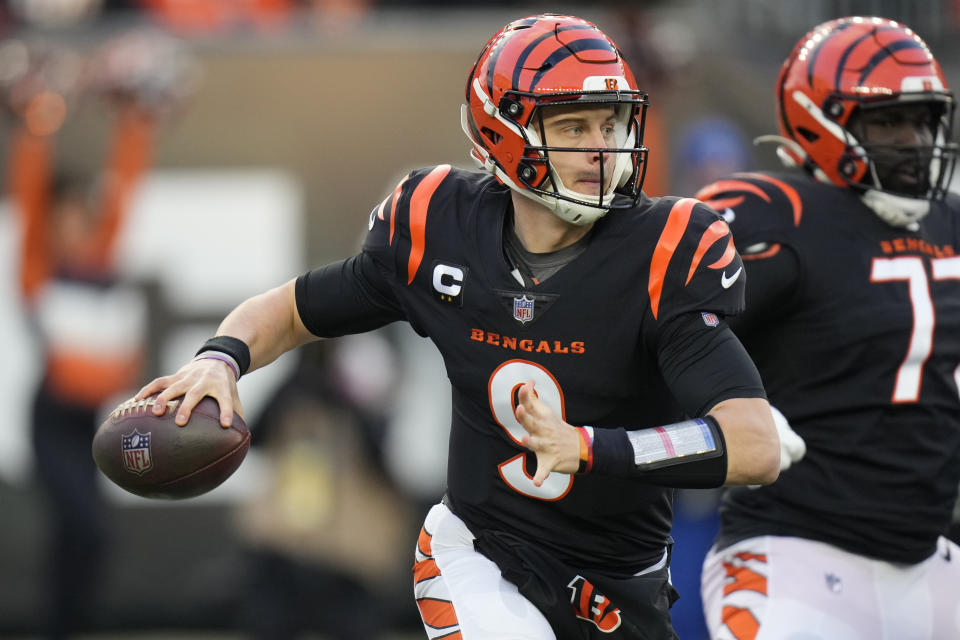 Cincinnati Bengals quarterback Joe Burrow (9) throws during the first half of an NFL wild-card playoff football game against the Las Vegas Raiders, Saturday, Jan. 15, 2022, in Cincinnati. (AP Photo/AJ Mast)