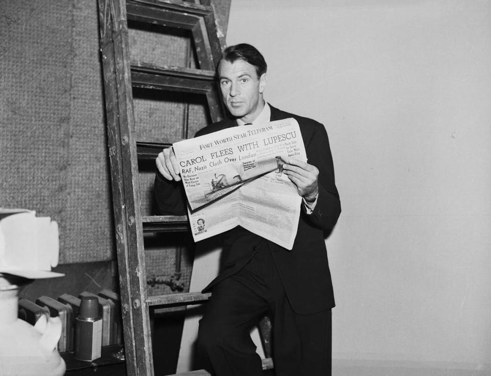 July 1940: Actor Gary Cooper reading a Fort Worth Star-Telegram newspaper. Fort Worth Star-Telegram archives/UT Arlington Special Collections