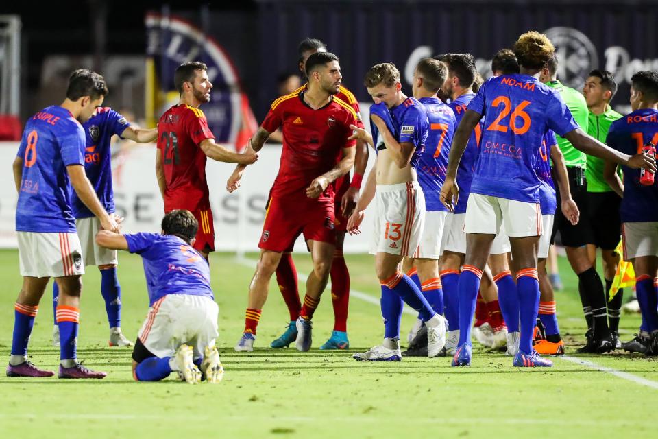 Phoenix Rising FC and Orange County SC players get into an argument during the second half against Orange County SC on Saturday, July 2, 2022, in Chandler.