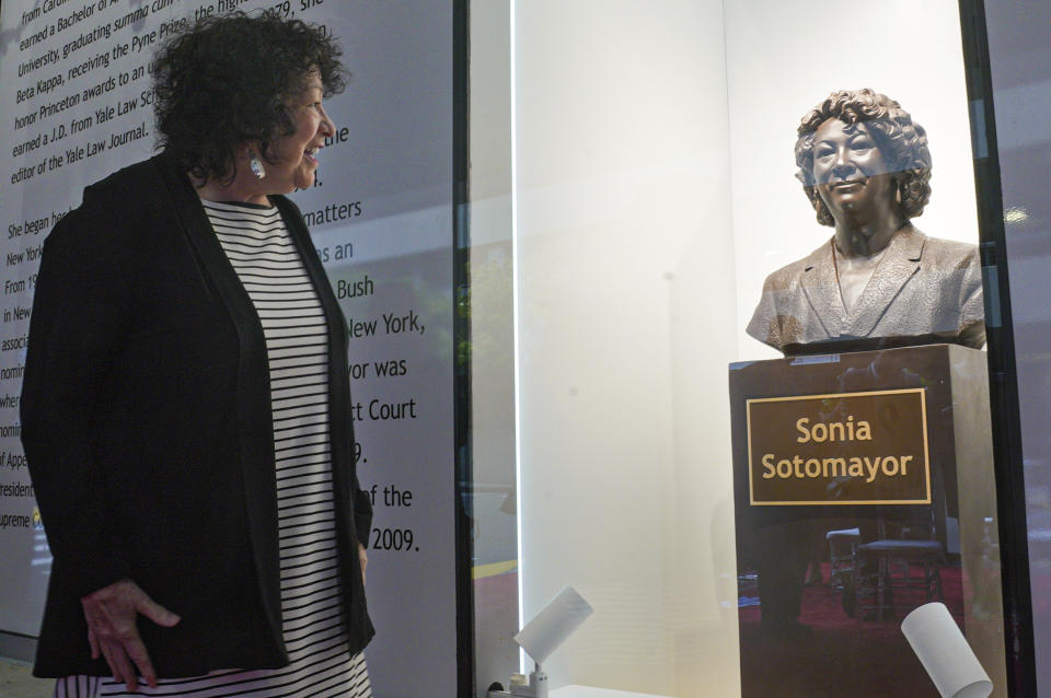 Supreme Court Justice Sonia Sotomayor reviews a statue of herself after its unveiling at Bronx Terminal Market, Thursday, Sept. 8, 2022, in New York. (AP Photo/Bebeto Matthews, Pool)