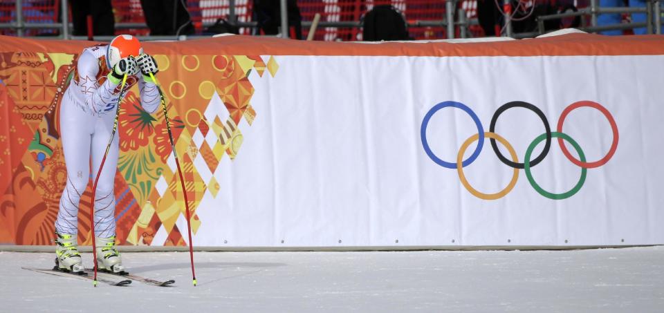 United States' Bode Miller rests on his ski poles after finishing the men's downhill at the Sochi 2014 Winter Olympics, Sunday, Feb. 9, 2014, in Krasnaya Polyana, Russia. (AP Photo/Gero Breloer)