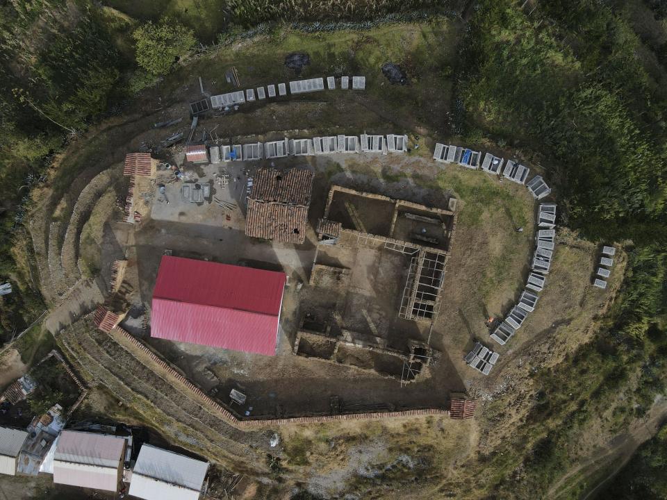 Tombs sit empty in a cemetery on what used to be an army base, where the remains of victims killed during the Maoist-inspired insurgency will be buried days after they were turned over to families in Accomarca, Peru, Thursday, May 19, 2022. / Credit: Martin Mejia / AP