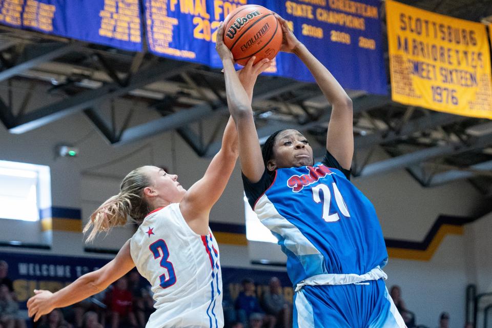 Indiana Junior All-Star Jayla Lampley (20) fights for the rebound against Kentucky Junior All-Star Kenleigh Woods (3) during their game on Sunday, June 2, 2024 in Scottsburg, Ind. at Charles E. Meyer Gymnasium for the first game of the Indiana vs Kentucky All-Stars basketball week.