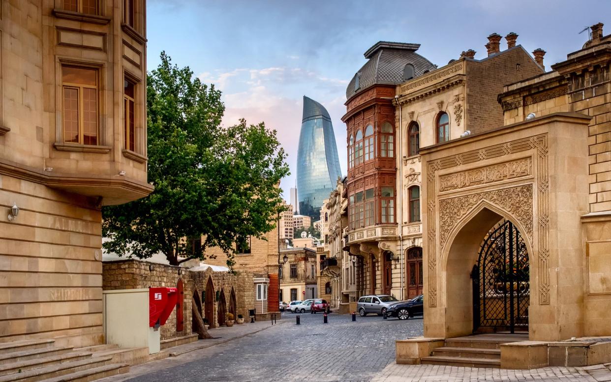Baku, Azerbaijan's capital, is often likened to Dubai for its outlandish architecture and appetite for gold - AP