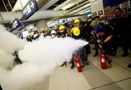 Protest at Yuen Long MTR station, the scene of an attack by suspected triad gang members a month ago, in Hong Kong