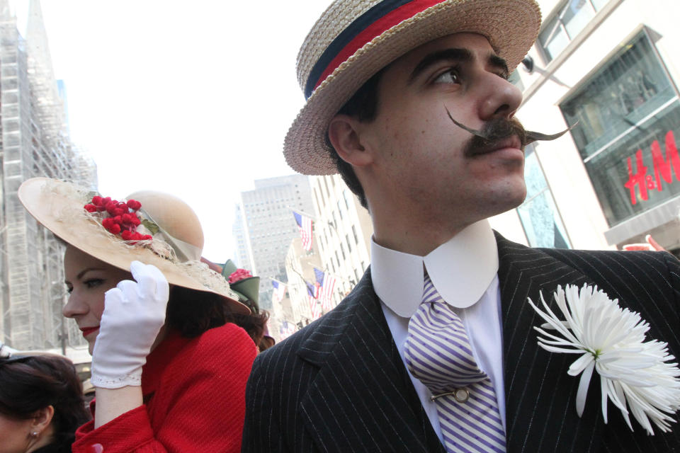 Dressed for the occasion, Horst Rosenberg, right, takes part in the Easter Parade along New York's Fifth Avenue, Sunday, April 20, 2014. (AP Photo/Tina Fineberg)