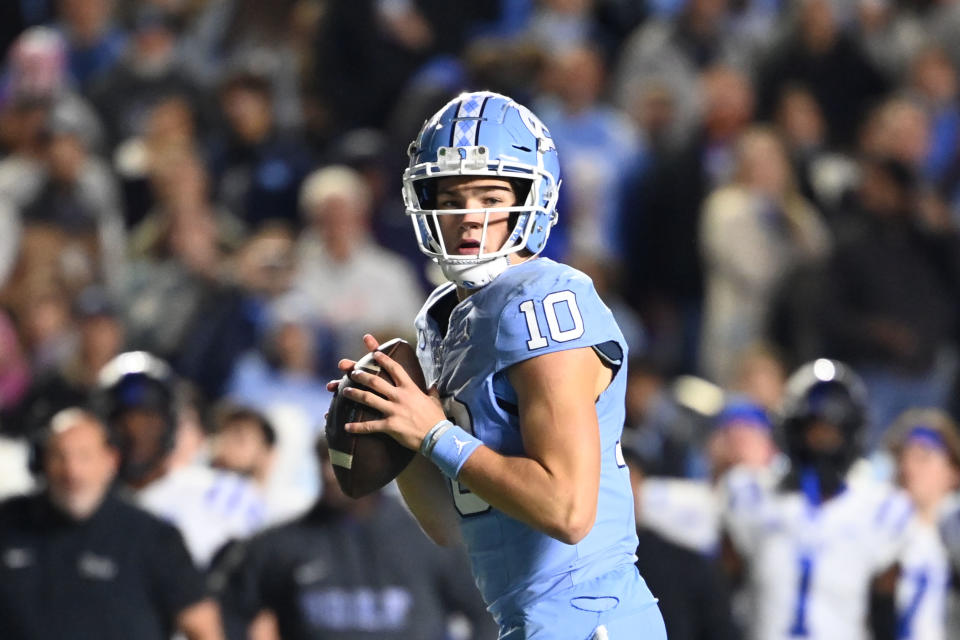 Nov 11, 2023; Chapel Hill, North Carolina, USA; DUPLICATE***North Carolina Tar Heels quarterback Drake Maye (10)***North Carolina Tar Heels defensive lineman Desmond Evans (10) looks to pass in the second quarter at Kenan Memorial Stadium. Mandatory Credit: Bob Donnan-USA TODAY Sports