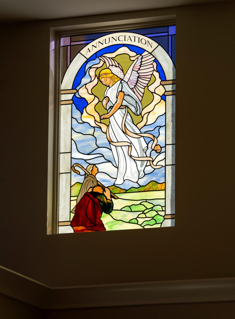 Jan Tuckwood, her sister, Lynn, and brother, Don, purchased the "Annunciation" window, left, in honor of their mother, who died in 2021. It is one of 14 leaded stained glass windows which tell the story of the life of Jesus.