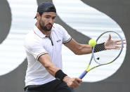 Italy's Matteo Berrettini plays a return to Britain's Andy Murray during the ATP tennis men's final match in Stuttgart, Germany, Sunday June 12, 2022. (Bernd Wei'brod/dpa via AP)