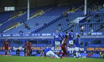 Liverpool's Trent Alexander-Arnold takes a free-kick during the English Premier League soccer match between Everton and Liverpool at Goodison Park in Liverpool, England, Sunday, June 21, 2020. (AP photo/Shaun Botterill, Pool)