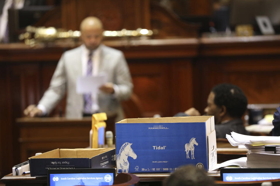 A box of amendments sits on the desk of South Carolina Rep. John King, D-Rock Hill, as he gets ready to speak against a bill to ban transgender athletes from girls' and women's public school and college sports teams on Tuesday, April 5, 2022, in Columbia, S.C. (AP Photo/Jeffrey Collins)