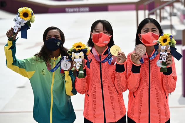 Brazil's Rayssa Leal (silver), Japan's Momiji Nishiya (gold), and Japan's Funa Nakayama (bronze) pose during the medal ceremony. (Photo: JEFF PACHOUD via Getty Images)