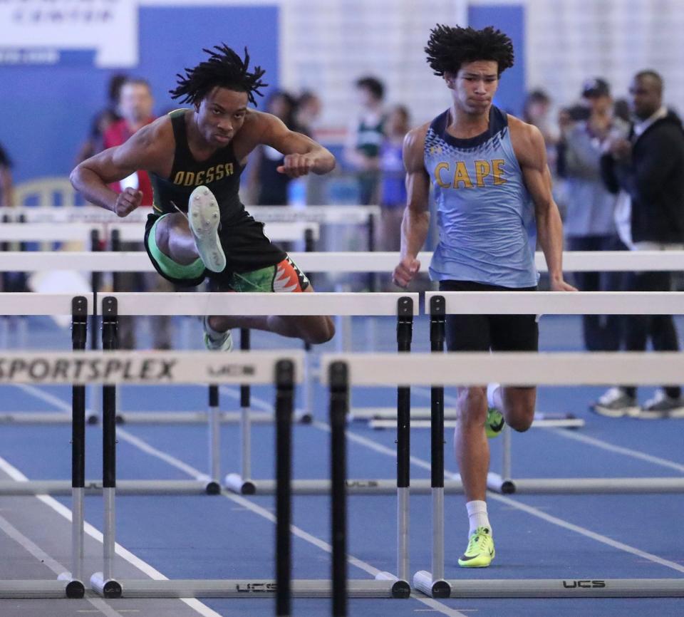 Odessa's Michael Latham (left) clears a hurdle en route to a first place finish in the 55 meter hurdles during the DIAA indoor track and field championships at the Prince George's Sports and Learning Complex in Landover, Md., Saturday, Feb. 3, 2023. Fourth-place finisher Robert Redden of Cape Henlopen races at right.