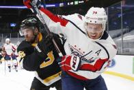 Washington Capitals' John Carlson (74) defends against Boston Bruins' David Krejci (46) during the second period of an NHL hockey game Friday, March 5, 2021, in Boston. (AP Photo/Michael Dwyer)