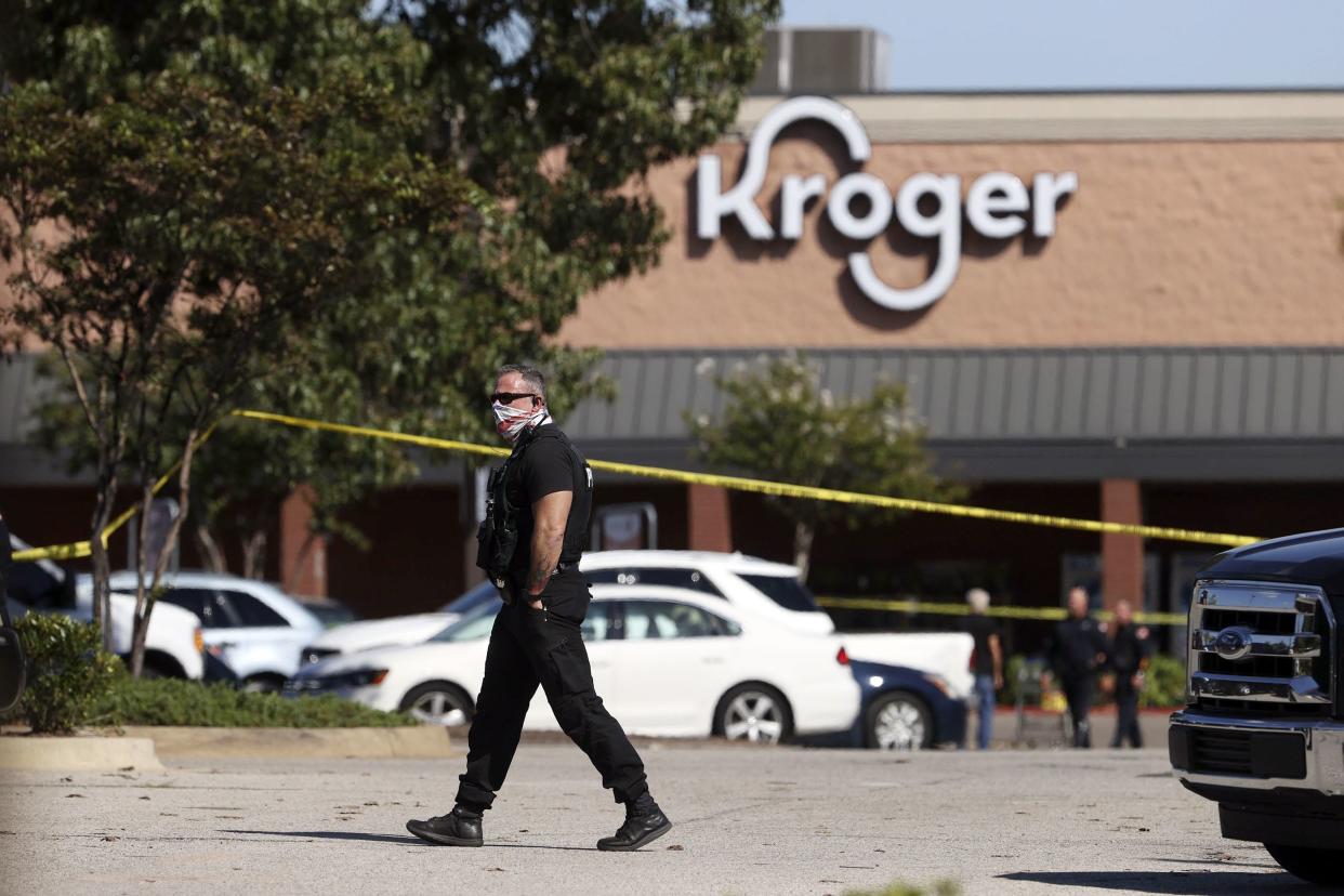 Police respond to the scene of a shooting at a Kroger's grocery store in Collierville, Tenn., on Thursday, Sept. 23, 2021.