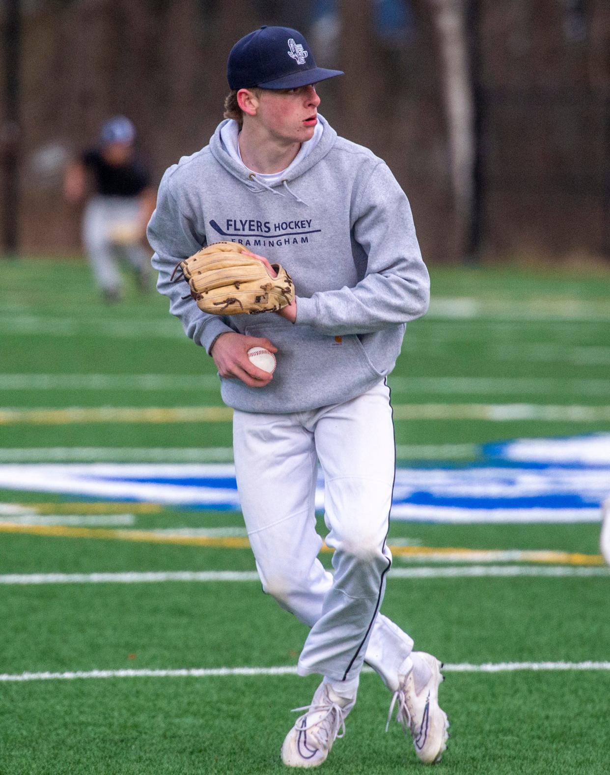 Framingham High School senior third baseman Robby White at baseball tryouts on the Fuller Middle School turf fields, March 20, 2024.